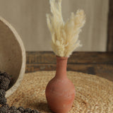 Ekaurr Set of 7 Terracotta Planters round compact forms styled on a shelf with faux plants indoor home decor display