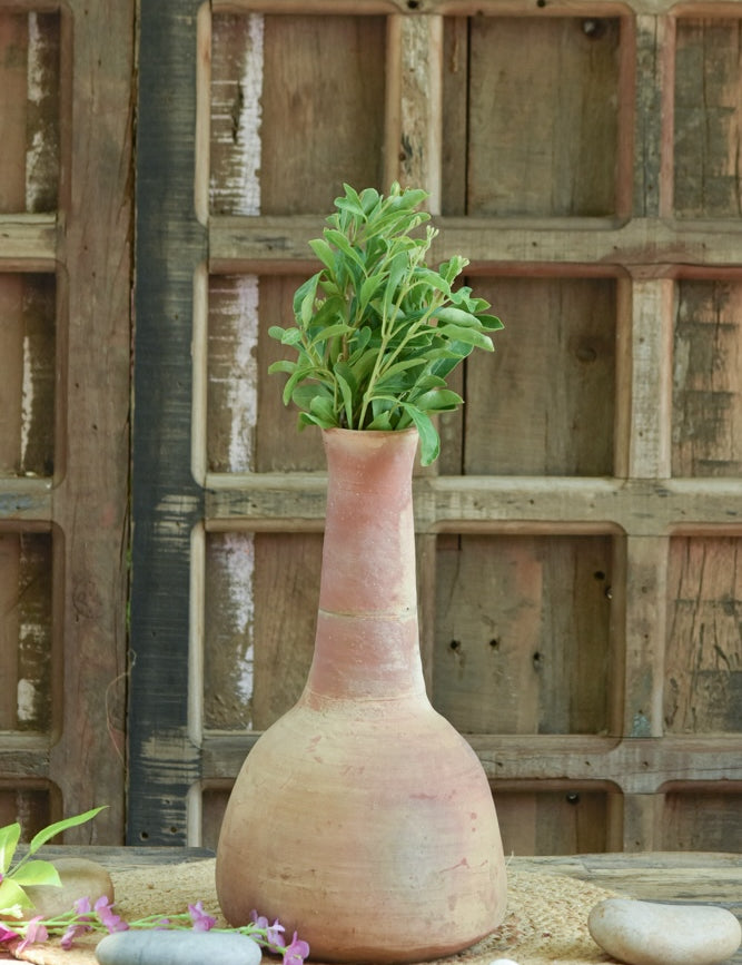 Ekaurr Sheeshi-Neck Planter in Pink – handmade terracotta planter styled on a console with frame and candle, artisan home decor
