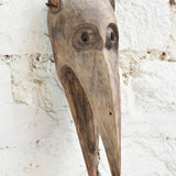 Ekaurr The Sky Watcher Mask detail view showing hand-chiselled facial carving, aged reclaimed wood texture and tribal character