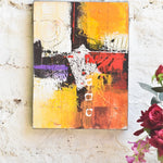 Ekaurr Solar Chords original abstract painting with warm amber orange red and violet tones animated by white linear elements and a spiral imprint suggesting musical vibration, handcrafted canvas art for living rooms and contemporary home interiors