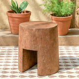 Ekaurr Solid Wood Chiseled Stool hand-carved from reclaimed wood with bold monolithic form, round top and arched base for rustic or contemporary interiors
