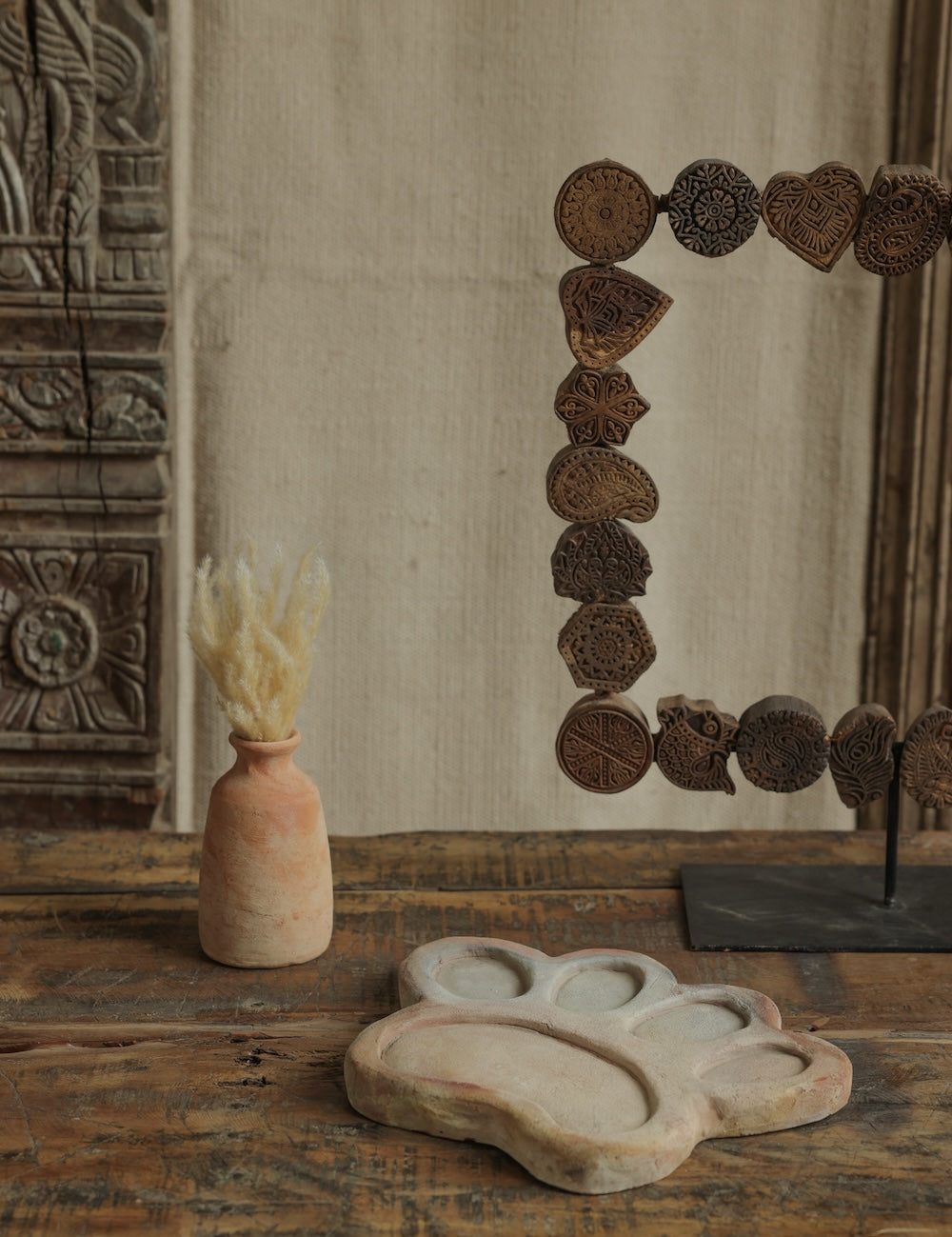 Ekaurr Terracotta Flower Design Riser handcrafted clay display stand with raised floral motif surface carving, earthy artisan pedestal for small sculptures candles or home decor accents