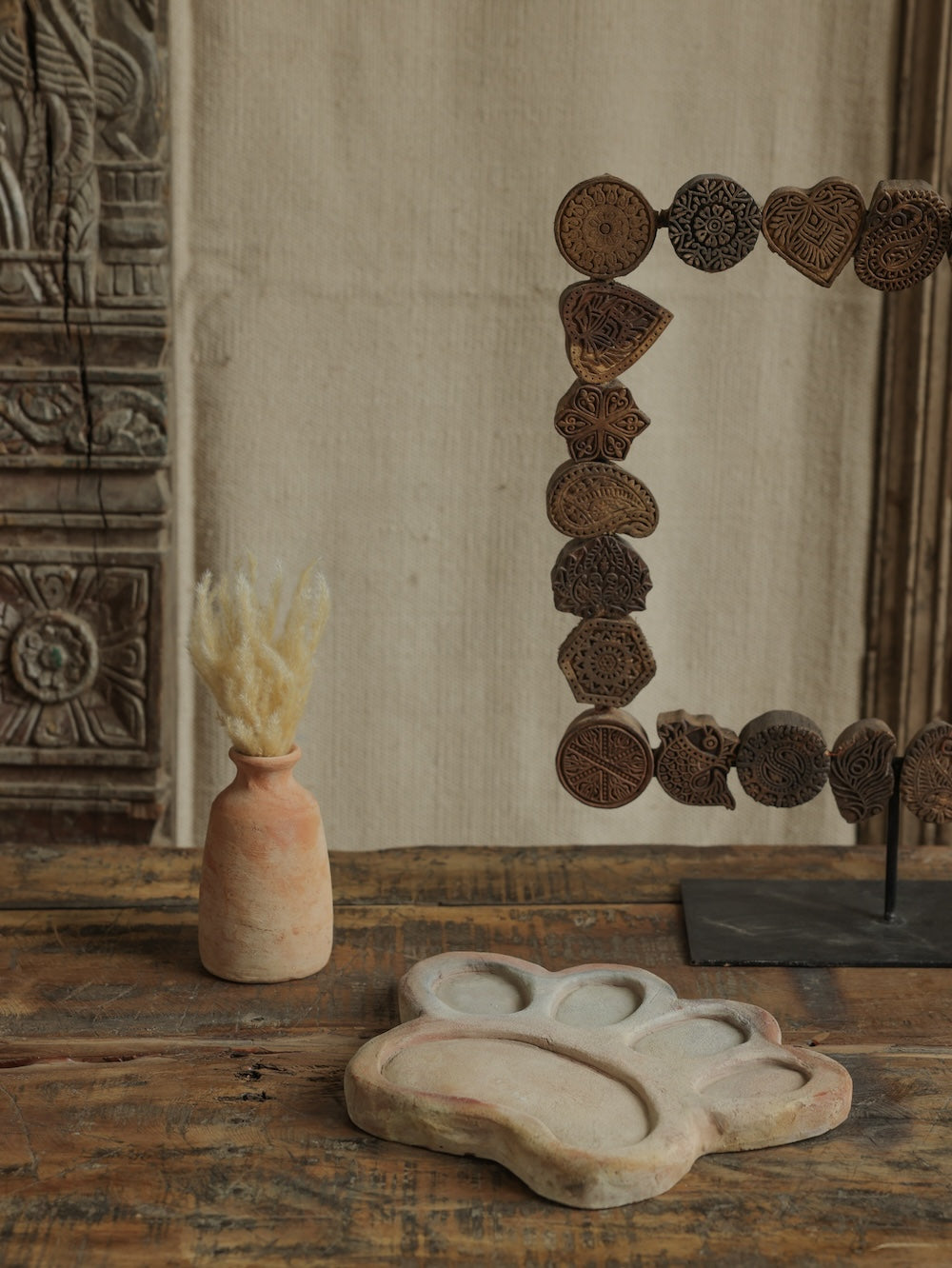 Ekaurr Terracotta Flower Design Riser handcrafted clay display stand with raised floral motif surface carving, earthy artisan pedestal for small sculptures candles or home decor accents