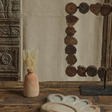 Ekaurr Terracotta Flower Design Riser handcrafted clay display stand with raised floral motif surface carving, earthy artisan pedestal for small sculptures candles or home decor accents