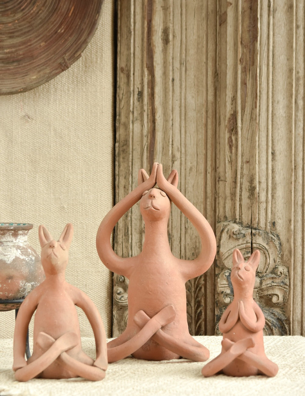 Ekaurr Set of 3 Terracotta Yoga Bunnies handcrafted natural clay bunny figurines each in a different yoga pose, playful artisan terracotta decor for shelves gifting and nature-inspired styling