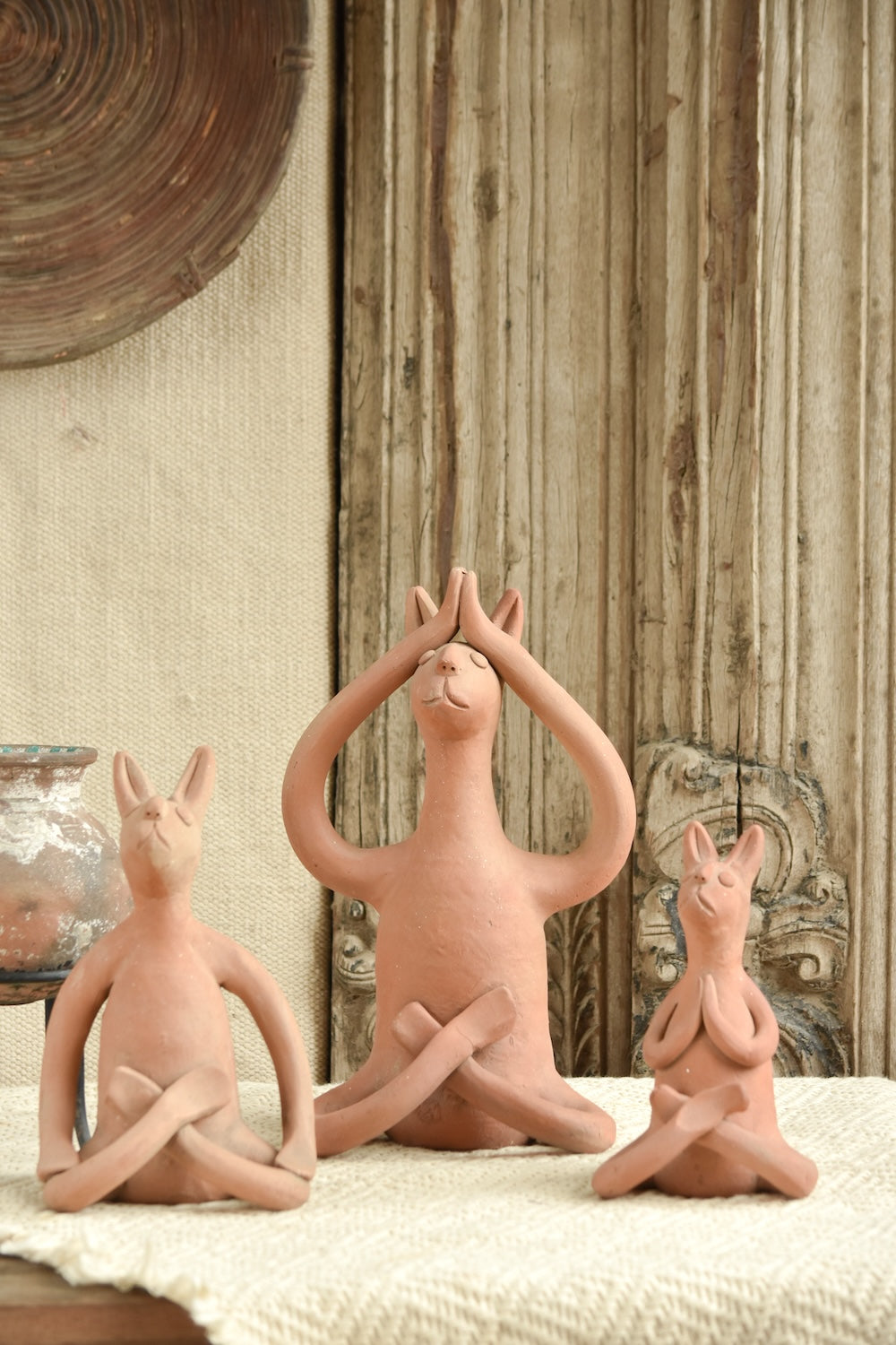 Ekaurr Set of 3 Terracotta Yoga Bunnies handcrafted natural clay bunny figurines each in a different yoga pose, playful artisan terracotta decor for shelves gifting and nature-inspired styling