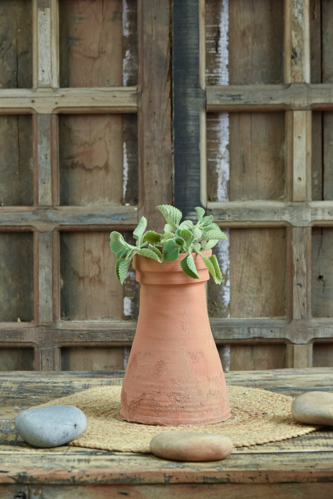 Ekaurr Thathera Cone Terracotta Pot handmade by rural Indian women artisans in tapered cone form inspired by traditional craftsmanship, earthy natural terracotta planter