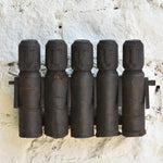 Ekaurr Tribal Wooden Dolls Set of 5 – abstract hand-carved silhouettes with rustic textures on a wall display