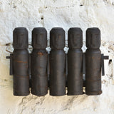 Ekaurr Tribal Wooden Dolls Set of 5 – abstract hand-carved silhouettes with rustic textures on a wall display
