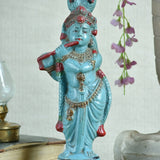 Ekaurr Turquoise Melody Krishna hand-painted idol in vibrant turquoise with flute and peacock feather crown beneath serpent hood, traditional devotional figurine for pooja rooms and home decor