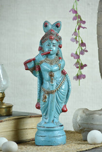 Ekaurr Turquoise Melody Krishna hand-painted idol in vibrant turquoise with flute and peacock feather crown beneath serpent hood, traditional devotional figurine for pooja rooms and home decor