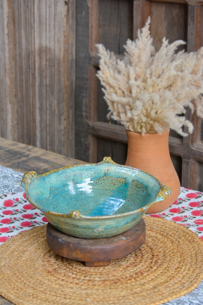 Ekaurr Turquoise Serving Bowl handmade ceramic serving bowl in vibrant turquoise glaze with organic hand-thrown form, artisan kitchen essential from the Liora charity collection for dining and table styling
