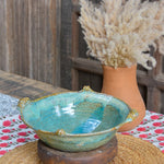 Ekaurr Turquoise Serving Bowl handmade ceramic serving bowl in vibrant turquoise glaze with organic hand-thrown form, artisan kitchen essential from the Liora charity collection for dining and table styling