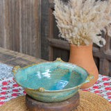 Ekaurr Turquoise Serving Bowl handmade ceramic serving bowl in vibrant turquoise glaze with organic hand-thrown form, artisan kitchen essential from the Liora charity collection for dining and table styling