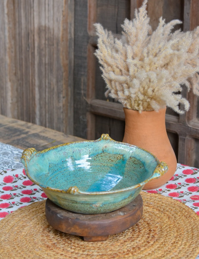 Ekaurr Turquoise Serving Bowl handmade ceramic serving bowl in vibrant turquoise glaze with organic hand-thrown form, artisan kitchen essential from the Liora charity collection for dining and table styling