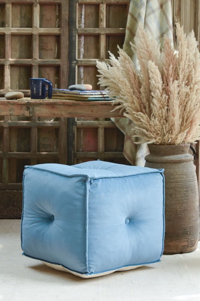 Ekaurr hand-tufted Velvet Pouffe in blue with piped edges and tailored stitching, versatile seating and footrest for modern interiors