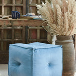 Ekaurr hand-tufted Velvet Pouffe in blue with piped edges and tailored stitching, versatile seating and footrest for modern interiors