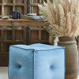 Ekaurr hand-tufted Velvet Pouffe in blue with piped edges and tailored stitching, versatile seating and footrest for modern interiors