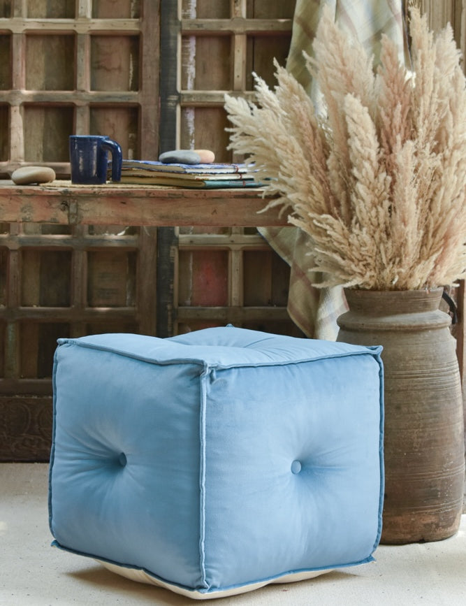 Ekaurr hand-tufted Velvet Pouffe in blue with piped edges and tailored stitching, versatile seating and footrest for modern interiors