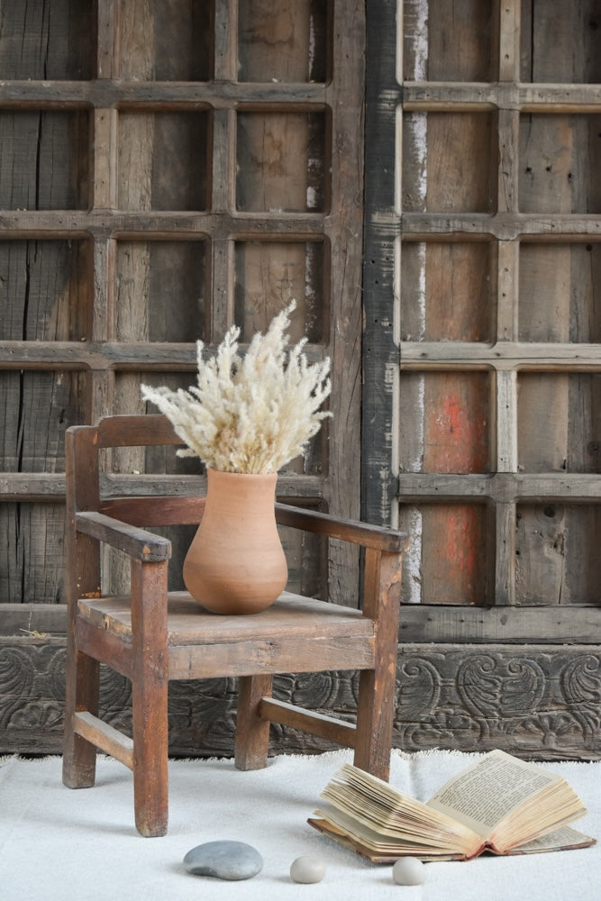 Ekaurr Vintage Accent Chair in brown reclaimed wood with natural imperfections and rustic patina, small handcrafted decorative seat or plant stand