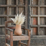 Ekaurr Vintage Accent Chair in brown reclaimed wood with natural imperfections and rustic patina, small handcrafted decorative seat or plant stand