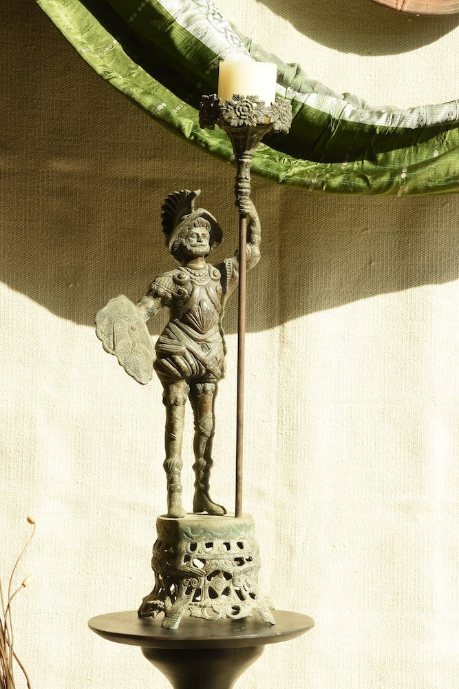 Ekaurr Vintage Brass Warrior Statue – commanding regal warrior figure with ornate armour, shield, and ceremonial staff, antique patina collectible sculpture