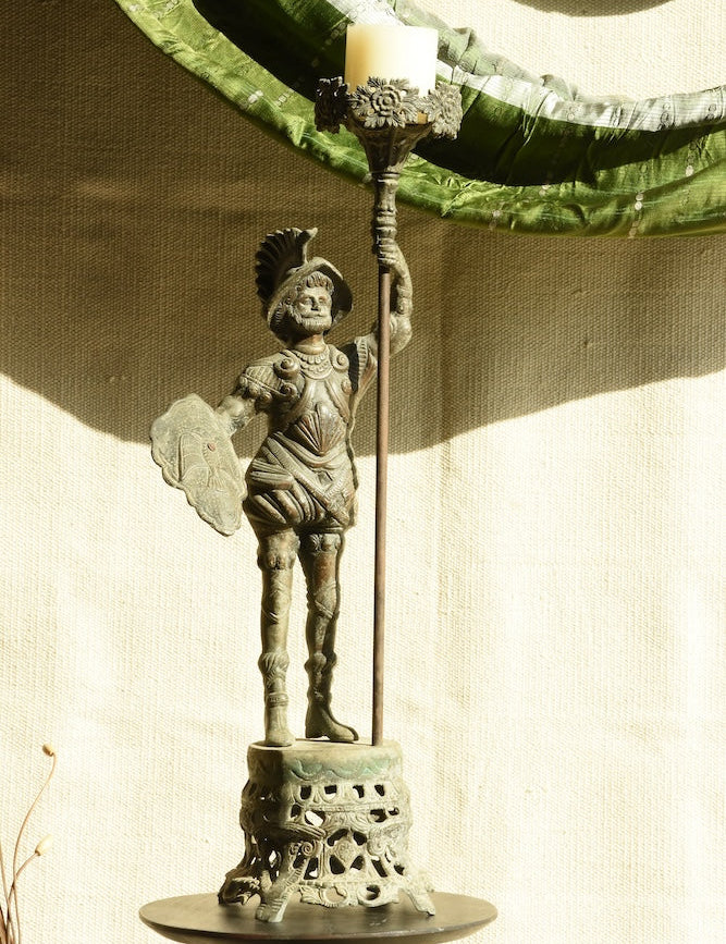 Ekaurr Vintage Brass Warrior Statue – commanding regal warrior figure with ornate armour, shield, and ceremonial staff, antique patina collectible sculpture