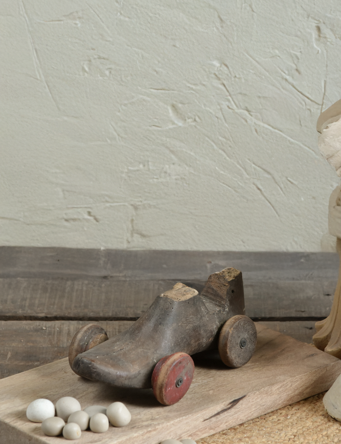 Ekaurr Vintage Shoe Car Decor crafted from an authentic cobbler's wooden shoe mold with rustic wheels, whimsical handcrafted heritage collectible accent piece
