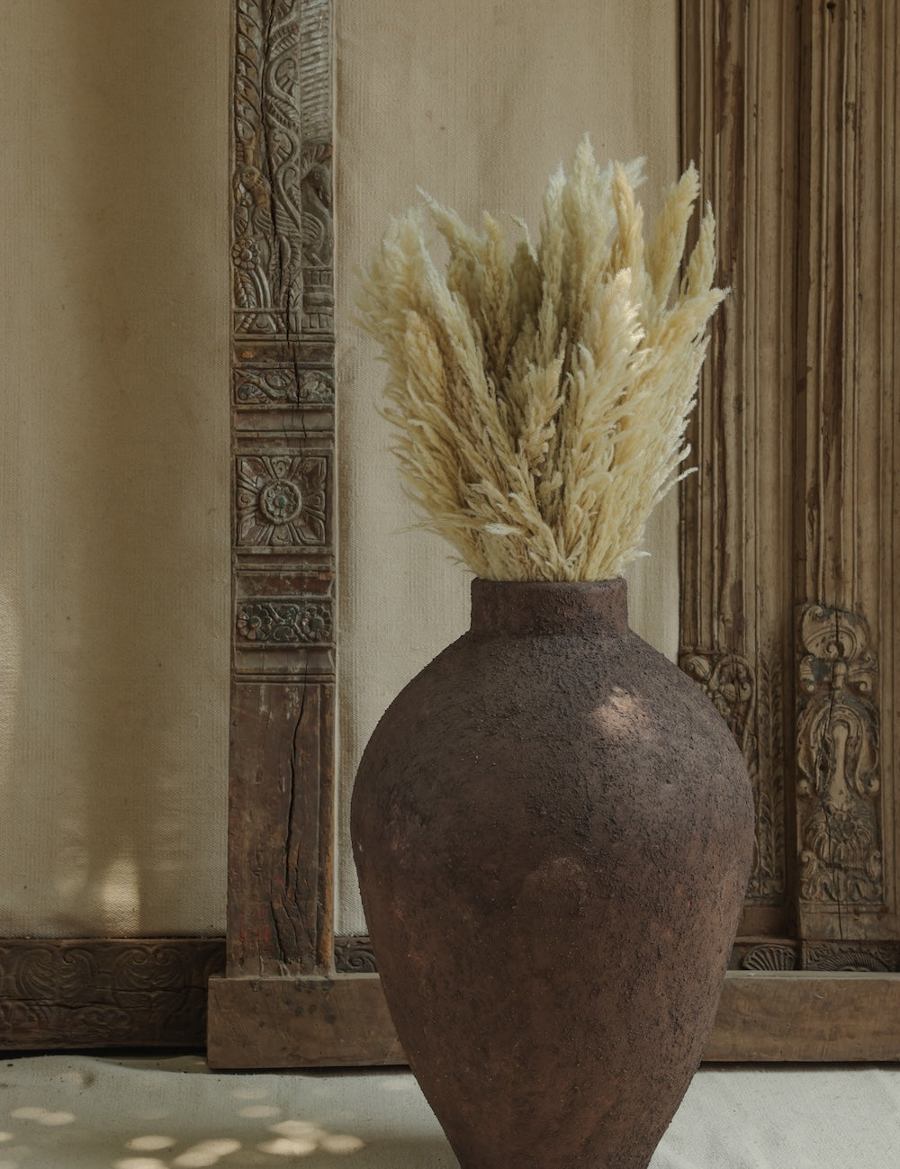 Ekaurr Volcano Terracotta Urn Medium dark brown rugged stone finish handmade by Indian artisans large decorative planter or centerpiece