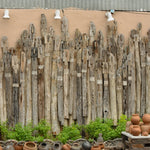 Ekaurr Wall of Unity Large monumental reclaimed wood wall installation of individually varied wooden sticks symbolising collective harmony at 180x50 inches, one-of-a-kind artisan architectural statement piece for large residential commercial or institutional spaces
