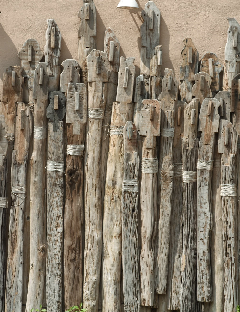 Ekaurr Wall of Unity Small large-scale reclaimed wood wall installation of varying-length wooden sticks arranged to symbolise unity in diversity at 90x50 inches, one-of-a-kind artisan architectural wall decor for statement walls and institutional or residential spaces