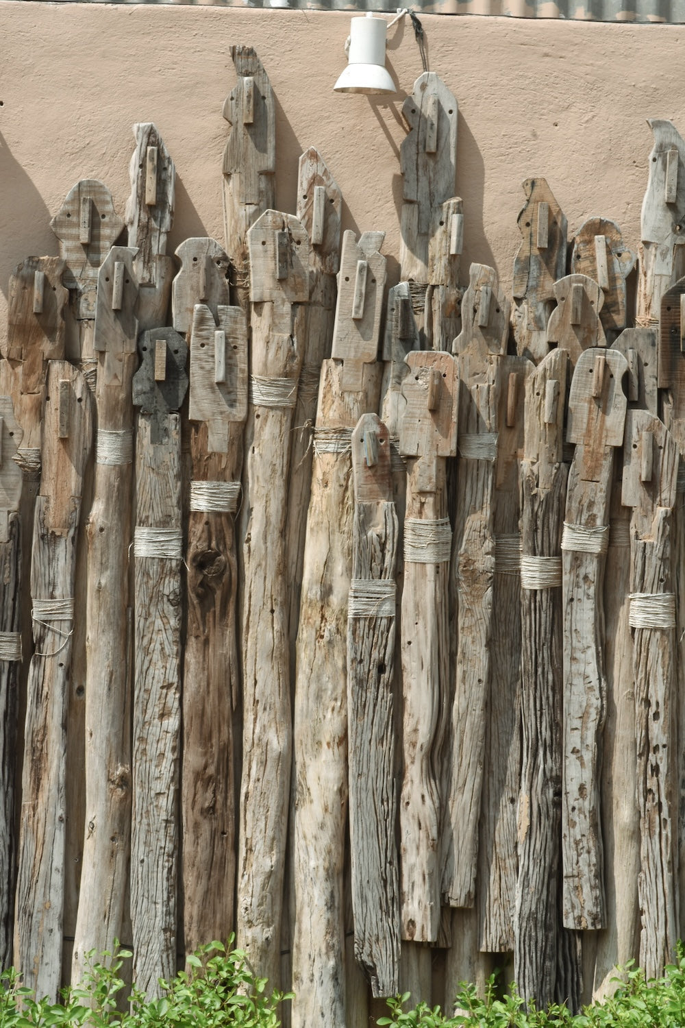 Ekaurr Wall of Unity Small large-scale reclaimed wood wall installation of varying-length wooden sticks arranged to symbolise unity in diversity at 90x50 inches, one-of-a-kind artisan architectural wall decor for statement walls and institutional or residential spaces