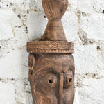Ekaurr The Water Bearer Mask angled view showing depth of carving, natural wood grain and hand-chiselled detail