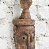 Ekaurr The Water Bearer Mask angled view showing depth of carving, natural wood grain and hand-chiselled detail