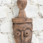 Ekaurr The Water Bearer Mask close-up showing intricate hand-carved facial details and earthy texture of vintage reclaimed wood