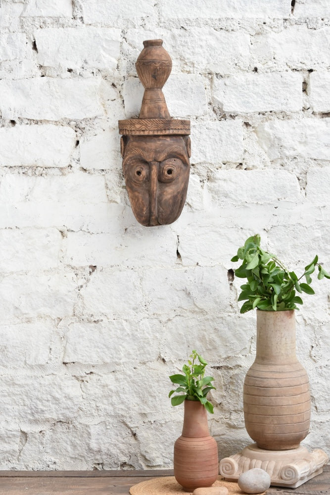 Ekaurr The Water Bearer hand-carved wooden tribal wall mask, vintage one-of-a-kind sculptural décor piece with expressive features and aged wood patina