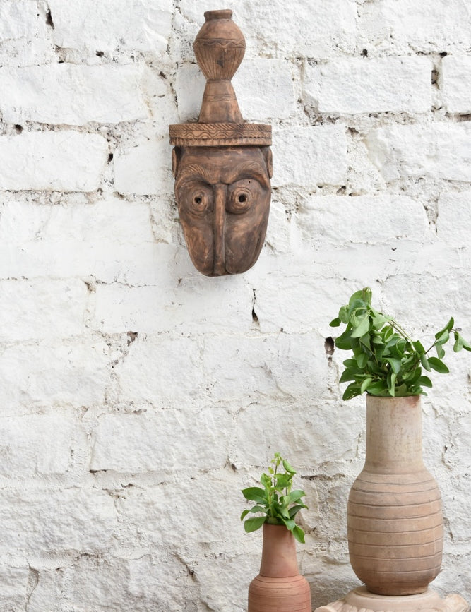 Ekaurr The Water Bearer hand-carved wooden tribal wall mask, vintage one-of-a-kind sculptural décor piece with expressive features and aged wood patina