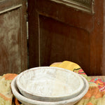 Ekaurr whitewashed round wooden trays styled as decorative display trays on a shelf or coffee table