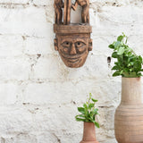 Ekaurr Wisdom Keeper hand-carved tribal wooden wall mask topped with two storytelling figures, vintage one-of-a-kind ancestral wisdom décor sculpture