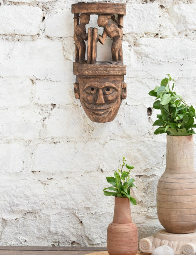 Ekaurr Wisdom Keeper hand-carved tribal wooden wall mask topped with two storytelling figures, vintage one-of-a-kind ancestral wisdom décor sculpture