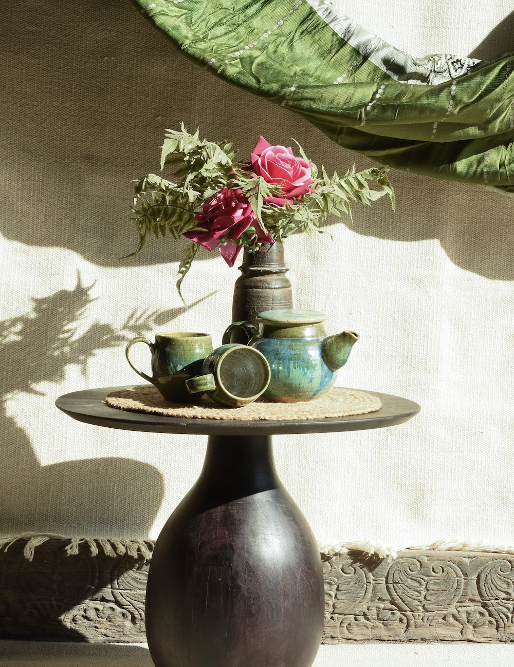 Ekaurr Wooden Drop Pedestal Table with hand-turned drop-shaped base, circular top and rich natural wood grain, artisan accent side table