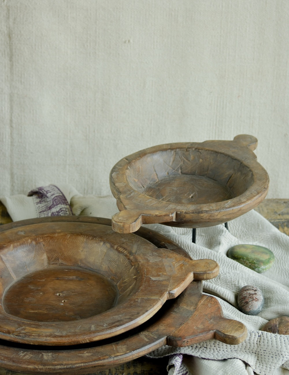 Ekaurr Wooden Paraat Set of 3 styled as decorative platters on console, showing natural wood grain finish and hand-done artisan detailing