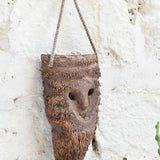 Detail view of Ekaurr Woodland Keeper wall mask showing carved botanical and woodland motifs with earthy natural finish