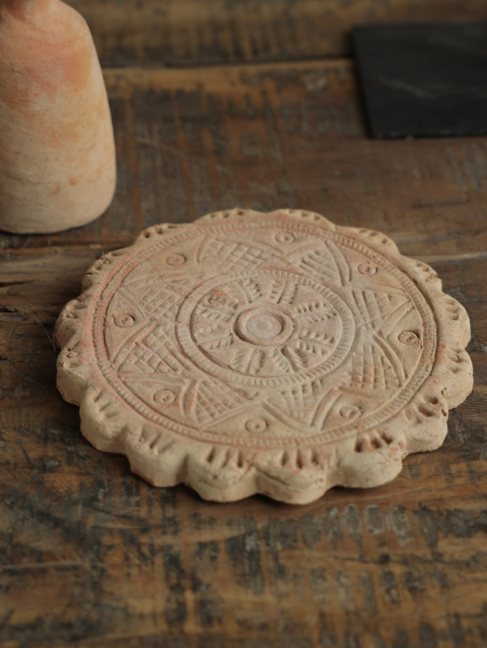 Ekaurr Terracotta Flower Design Riser handcrafted clay display stand with raised floral motif surface carving, earthy artisan pedestal for small sculptures candles or home decor accents