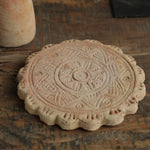 Ekaurr Terracotta Flower Design Riser handcrafted clay display stand with raised floral motif surface carving, earthy artisan pedestal for small sculptures candles or home decor accents